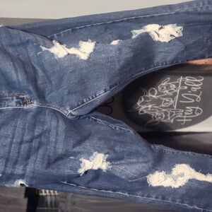 Distressed Blue Denim Jeans